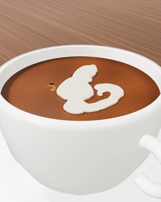 A top-down view of a coffee cup with white milk foam forming a squirrel latte art pattern